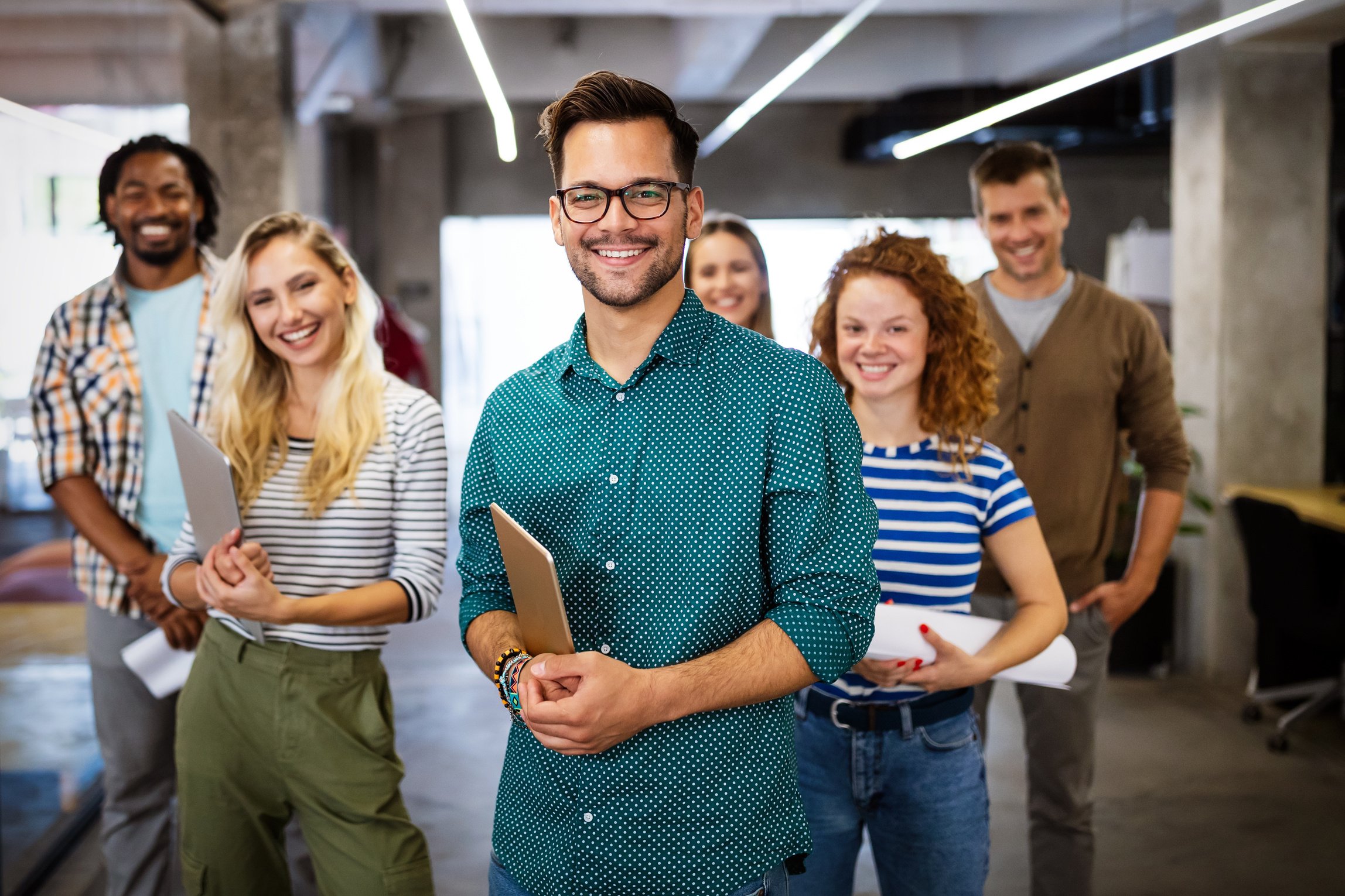 Successful company with happy employees in modern office